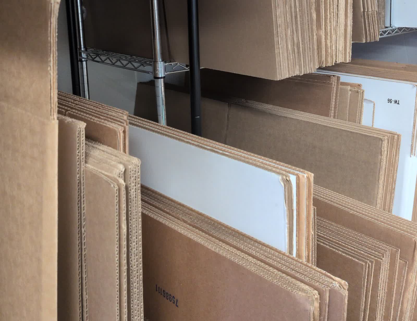 Stacks of cardboard boxes for sale at Valley Mail